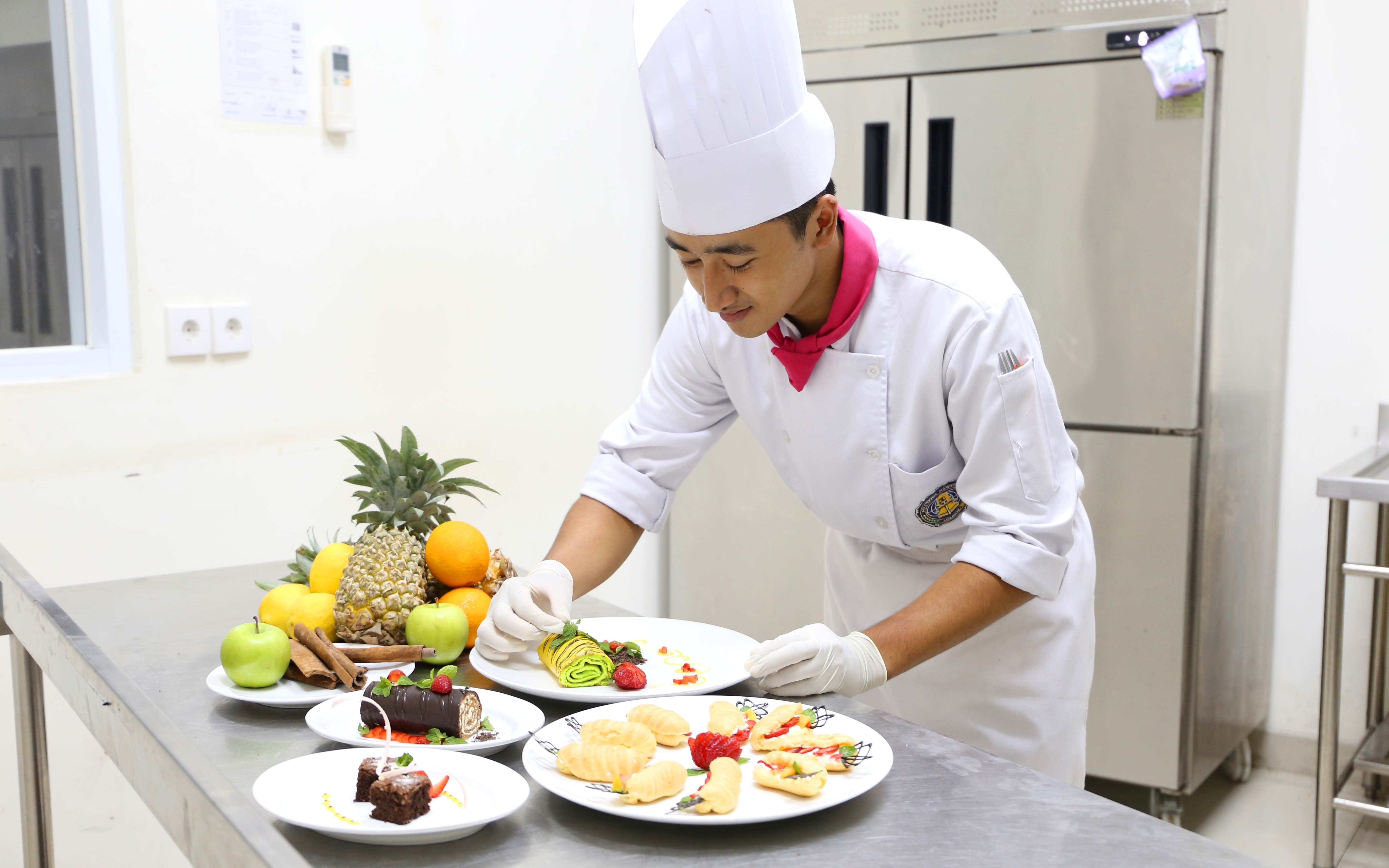 A chef prepares various dishes. 